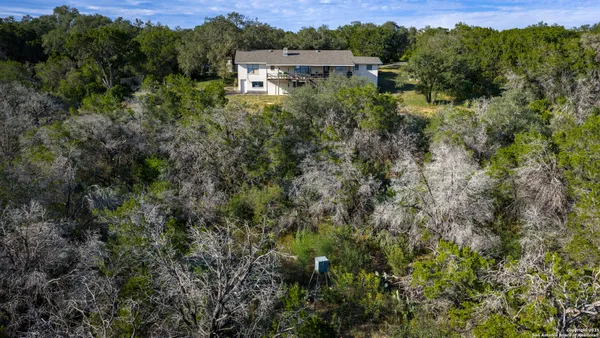 an aerial view of houses with yard