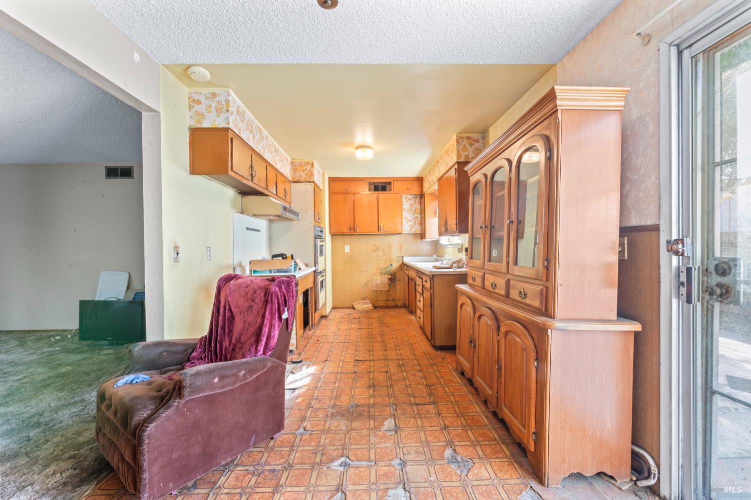 58 Solano Avenue Bay Point, CA 94565 - Photo 12 of 33 a view of living room kitchen with furniture and a fireplace