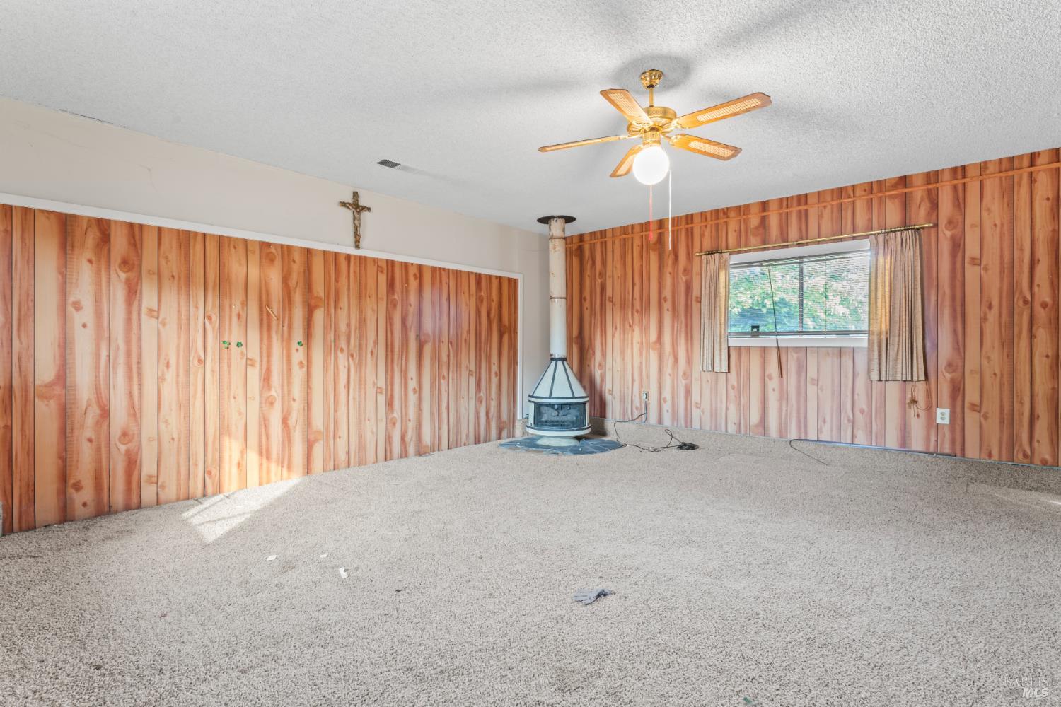 58 Solano Avenue Bay Point, CA 94565 - Photo 16 of 33 an empty room with windows and fan