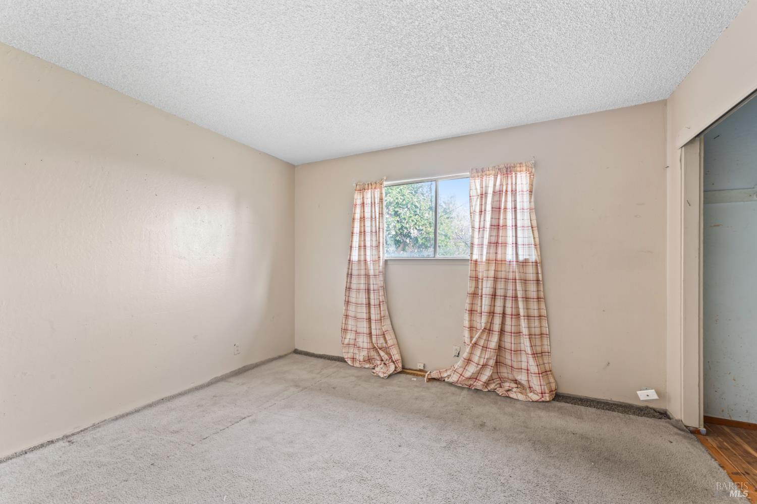 58 Solano Avenue Bay Point, CA 94565 - Photo 19 of 33 an empty room with windows