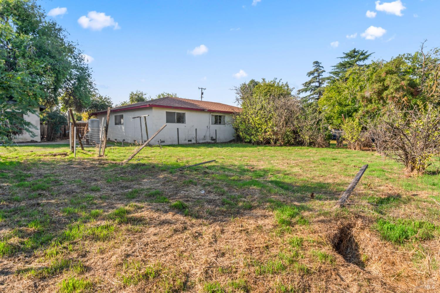 58 Solano Avenue Bay Point, CA 94565 - Photo 32 of 33 a big yard with trees in front of it
