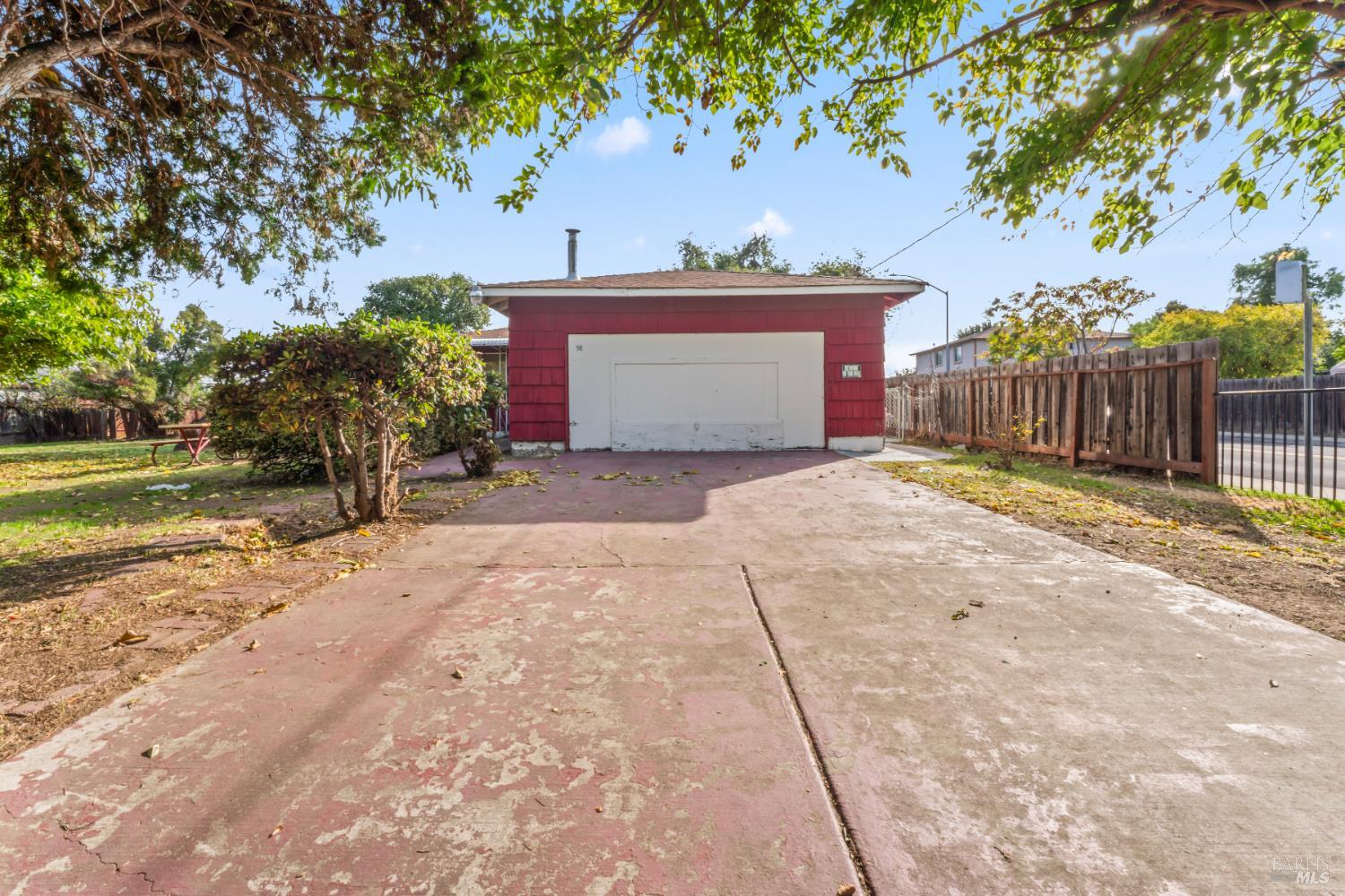 58 Solano Avenue Bay Point, CA 94565 - Photo 8 of 33 a view of a house with a yard and garage