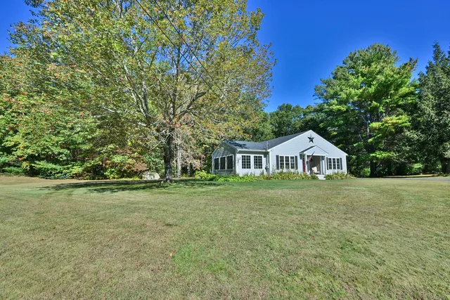 a front of a house with a garden