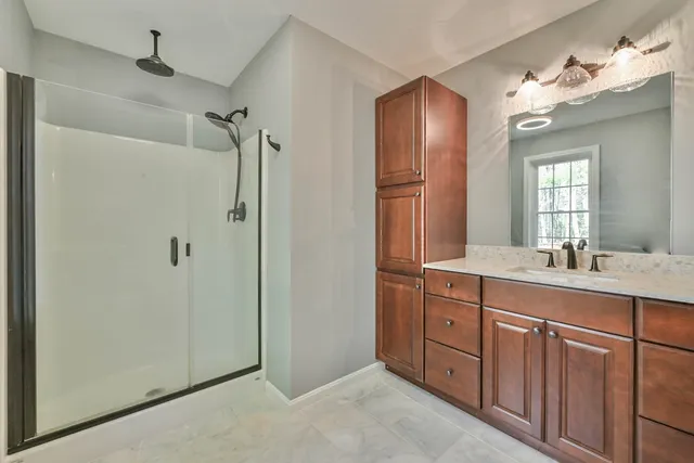 a bathroom with a double vanity sink mirror and double