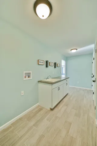 a view of a kitchen with a sink
