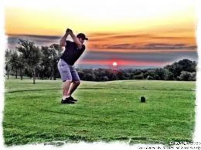 a view of a golf course with a lake