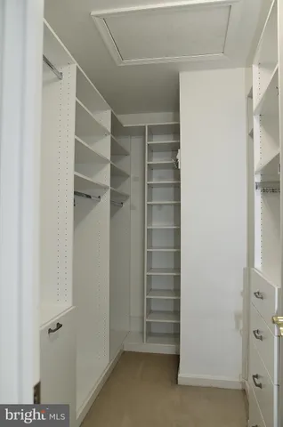 a view of closet area with empty racks