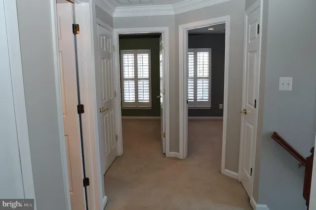 a view of a livingroom and a hallway