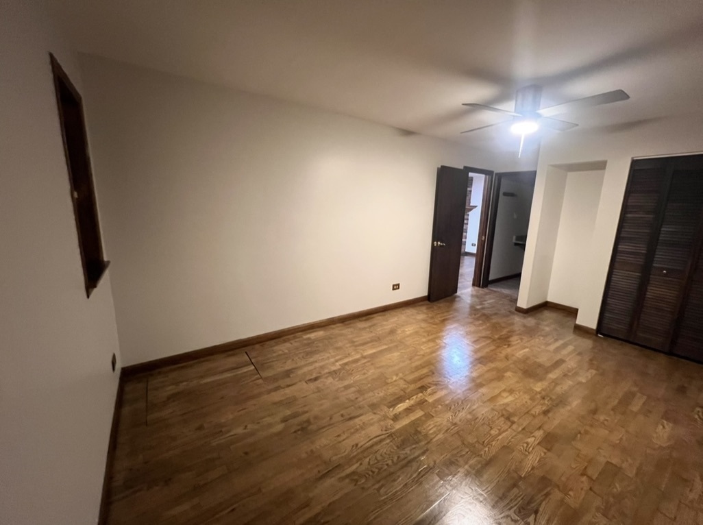 3529 Carpenter Street Steger, IL 60475 - Photo 12 of 20 an empty room with stairs and wooden floor
