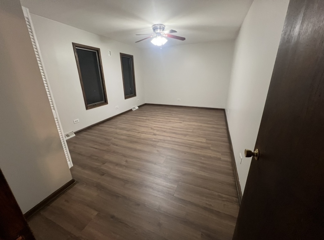 3529 Carpenter Street Steger, IL 60475 - Photo 15 of 20 wooden floor in an empty room with a window