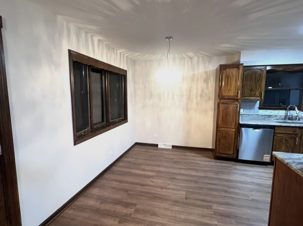 3529 Carpenter Street Steger, IL 60475 - Photo 4 of 20 a view of a kitchen from the hallway