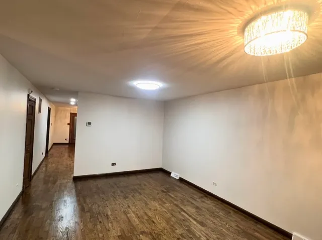 a view of a livingroom with wooden floor