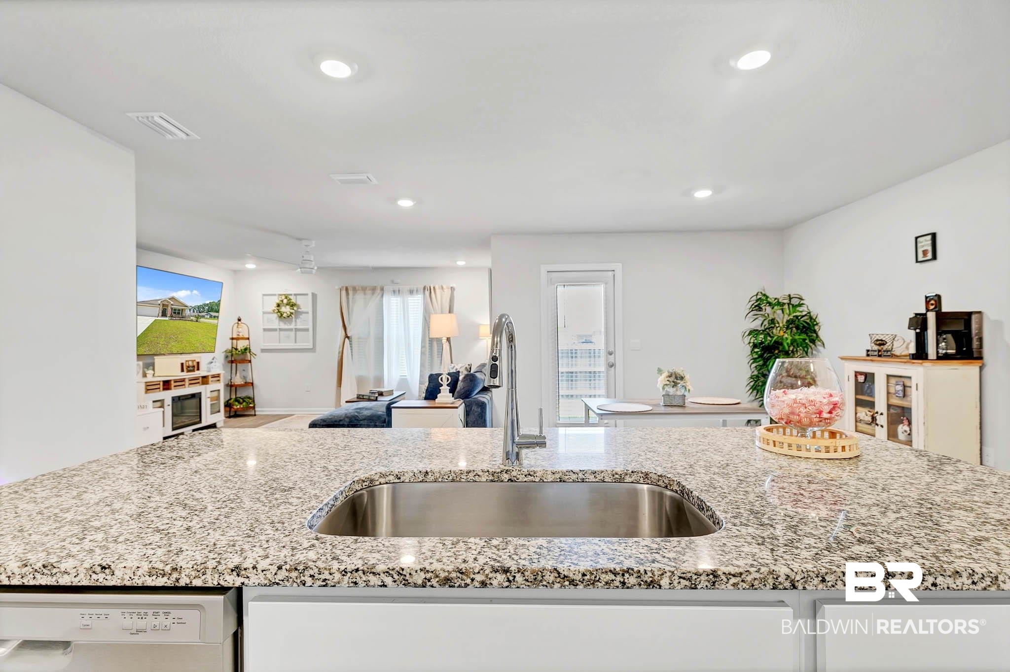17217 REFLECTION Street Loxley, AL 36551 - Photo 82 of 83 Kitchen with white dishwasher, light stone countertops, recessed lighting, open floor plan, and white cabinetry