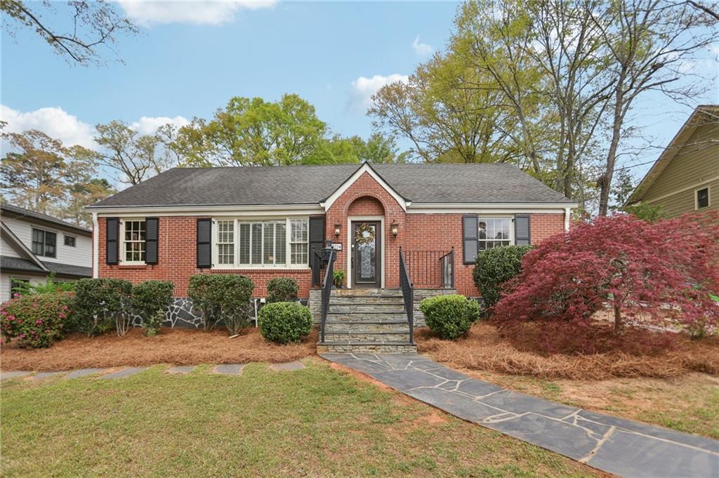 3224 Kensington Road Avondale Estates, GA 30002 - Photo 1 of 59 a front view of a house with garden