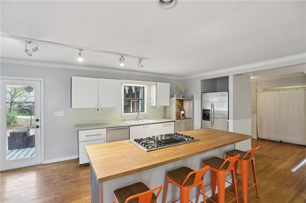 3224 Kensington Road Avondale Estates, GA 30002 - Photo 13 of 59 a kitchen with a table and chairs