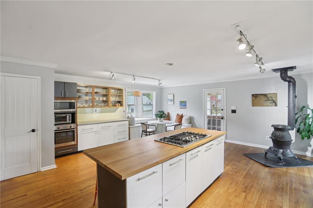 3224 Kensington Road Avondale Estates, GA 30002 - Photo 16 of 59 a kitchen with a stove a sink and a refrigerator
