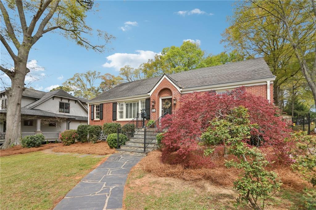 3224 Kensington Road Avondale Estates, GA 30002 - Photo 2 of 59 a front view of a house with a yard