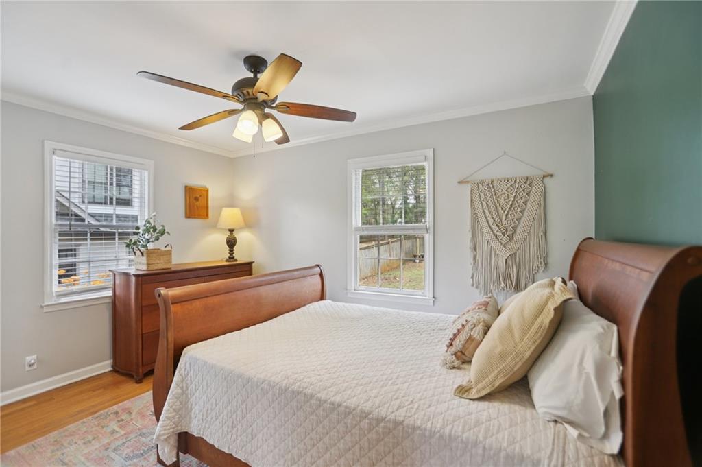 3224 Kensington Road Avondale Estates, GA 30002 - Photo 22 of 59 a bedroom with a bed and a chandelier