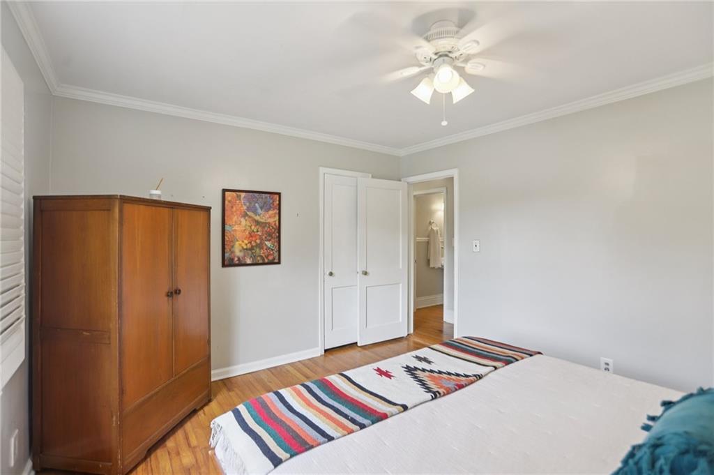 3224 Kensington Road Avondale Estates, GA 30002 - Photo 26 of 59 a bedroom with a bed and a chandelier