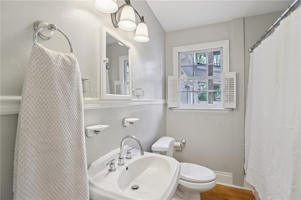 3224 Kensington Road Avondale Estates, GA 30002 - Photo 29 of 59 a bathroom with a toilet a sink and mirror