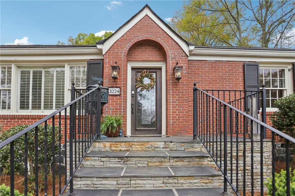 3224 Kensington Road Avondale Estates, GA 30002 - Photo 3 of 59 a front view of a house with a garden