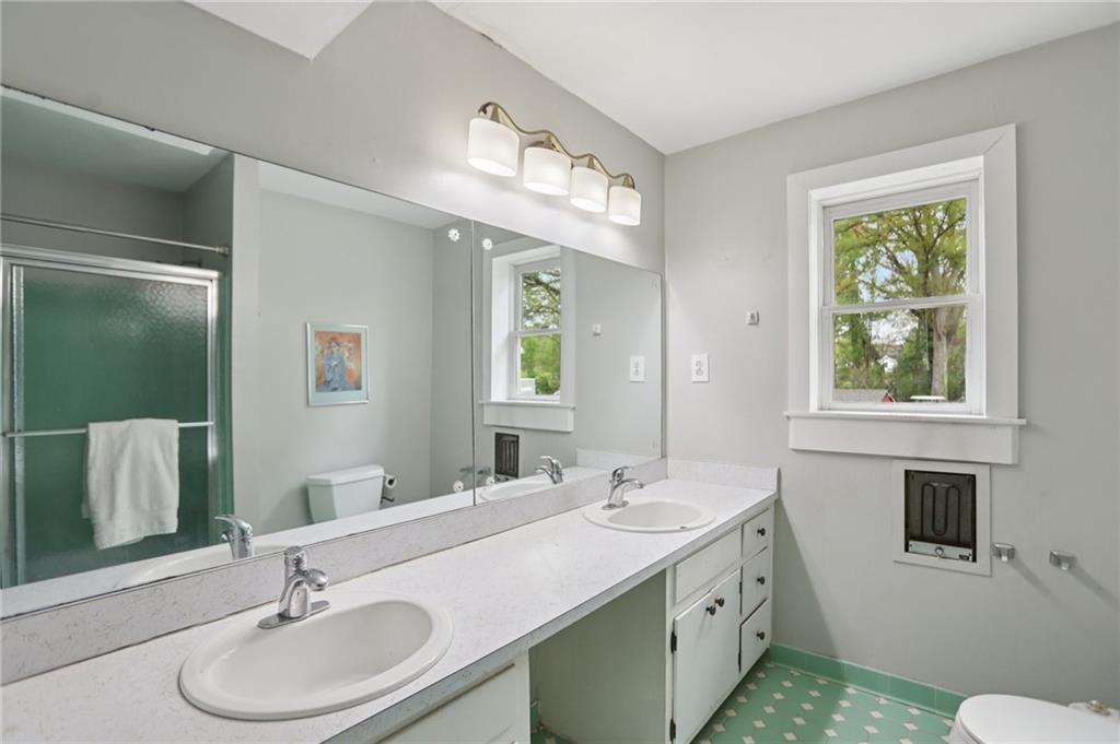3224 Kensington Road Avondale Estates, GA 30002 - Photo 34 of 59 a bathroom with a sink and a mirror