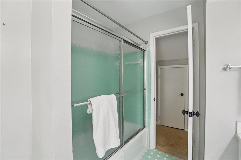 3224 Kensington Road Avondale Estates, GA 30002 - Photo 35 of 59 a bathroom with a shower and a mirror