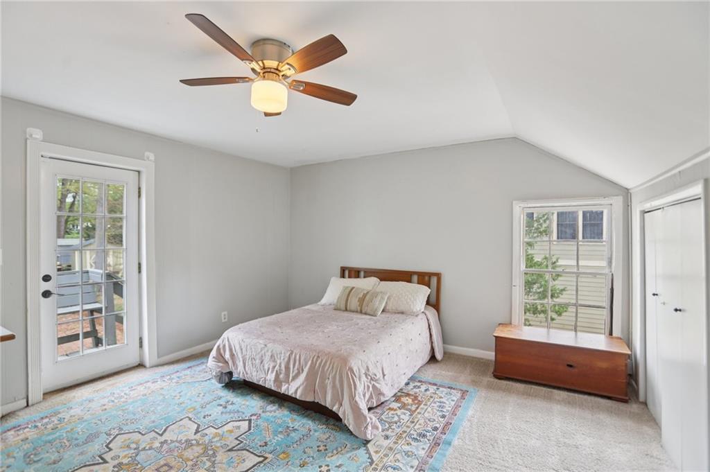 3224 Kensington Road Avondale Estates, GA 30002 - Photo 36 of 59 a bedroom with a bed ceiling fan and a window