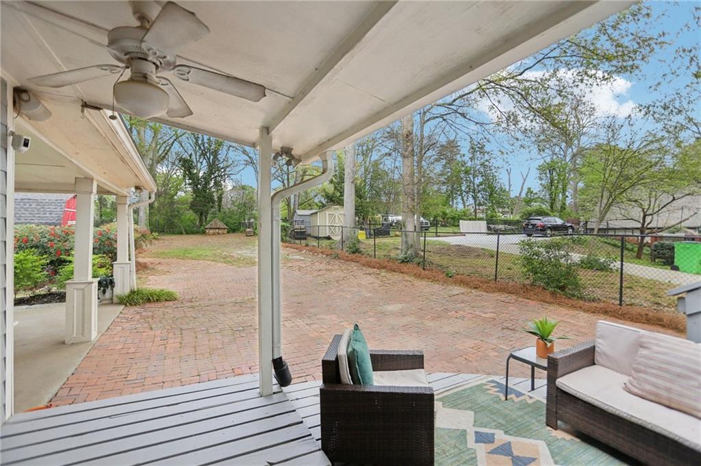 3224 Kensington Road Avondale Estates, GA 30002 - Photo 39 of 59 a view of a patio with table and chairs potted plants with wooden floor
