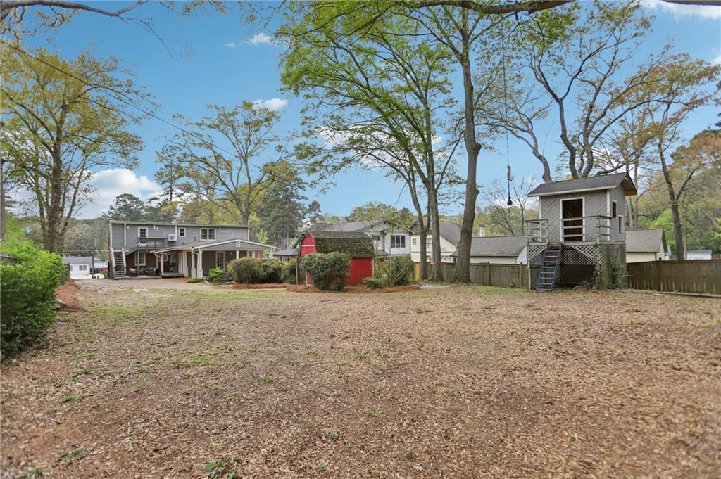 3224 Kensington Road Avondale Estates, GA 30002 - Photo 44 of 59 a front view of a house with a yard and garage