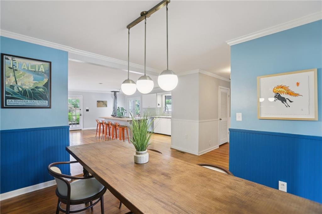 3224 Kensington Road Avondale Estates, GA 30002 - Photo 9 of 59 a view of a dining room with furniture and wooden floor