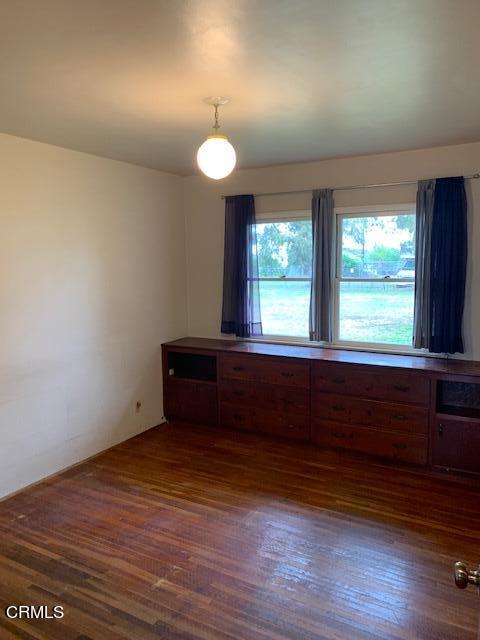 1561 Little Farms Road Oxnard, CA 93030 - Photo 11 of 37 an empty room with wooden floor and windows