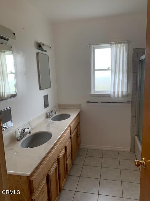 1561 Little Farms Road Oxnard, CA 93030 - Photo 12 of 37 a bathroom with a sink and a mirror