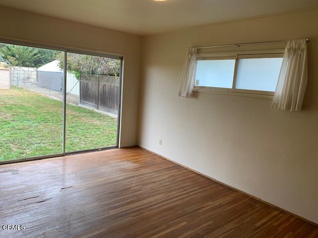 1561 Little Farms Road Oxnard, CA 93030 - Photo 13 of 37 a view of an empty room with a window and wooden floor