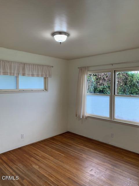 1561 Little Farms Road Oxnard, CA 93030 - Photo 15 of 37 an empty room with wooden floor and windows