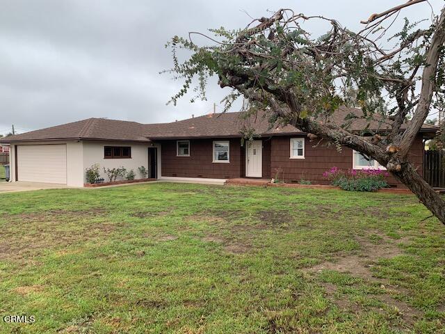 1561 Little Farms Road Oxnard, CA 93030 - Photo 2 of 37 a front view of a house with a garden