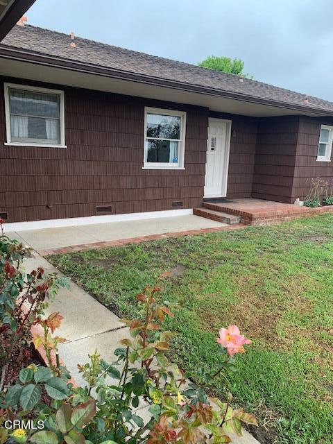1561 Little Farms Road Oxnard, CA 93030 - Photo 5 of 37 a front view of a house with a yard