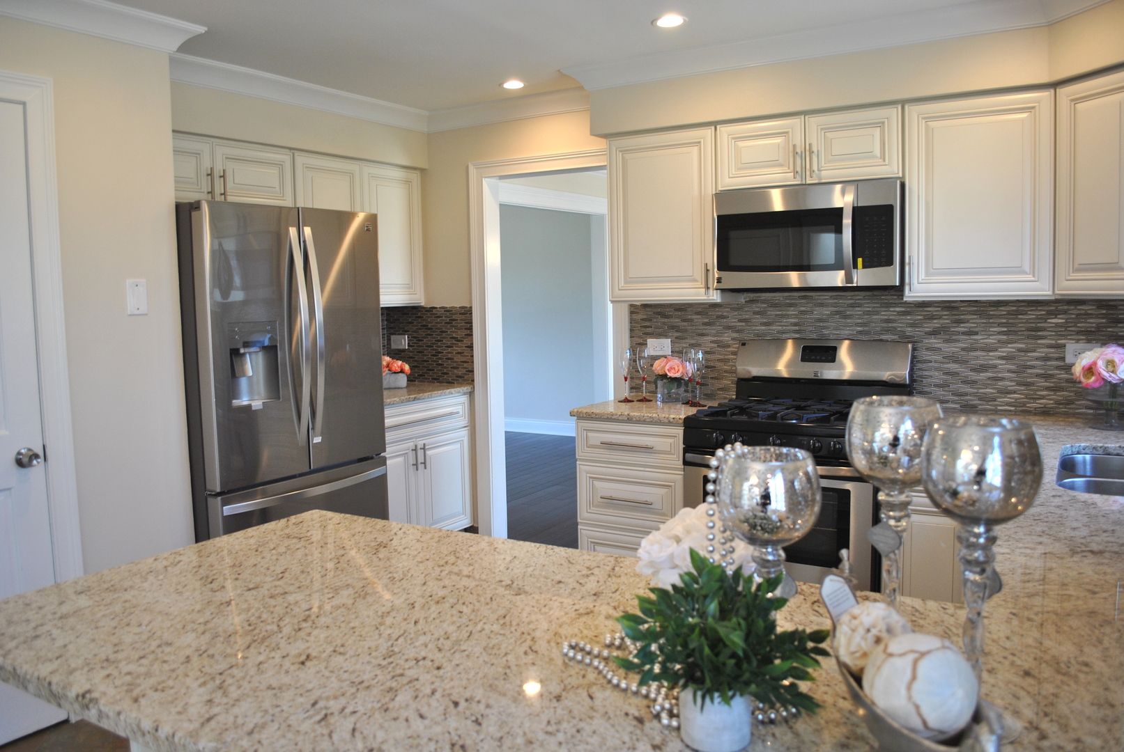 29W128 Wagner Road Naperville, IL 60564 - Photo 8 of 25 a kitchen with stainless steel appliances granite countertop a refrigerator stove and microwave