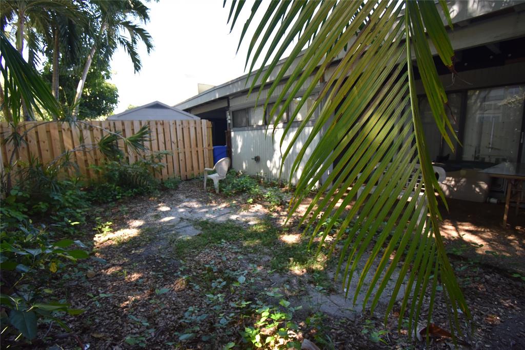 1713 Northwest 73rd Avenue, Unit 34 Plantation, FL 33313 - Photo 20 of 26 a view of a backyard