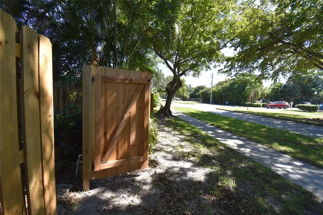 a view of a backyard with pathway