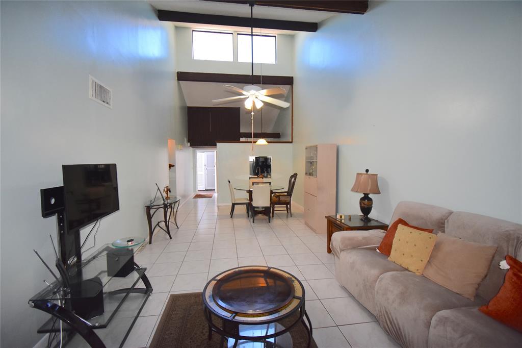 1713 Northwest 73rd Avenue, Unit 34 Plantation, FL 33313 - Photo 8 of 26 a living room with furniture and a fireplace