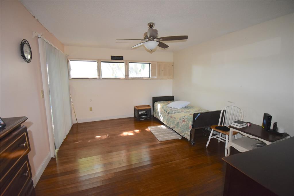 1713 Northwest 73rd Avenue, Unit 34 Plantation, FL 33313 - Photo 10 of 26 a view of a workspace with furniture and a window