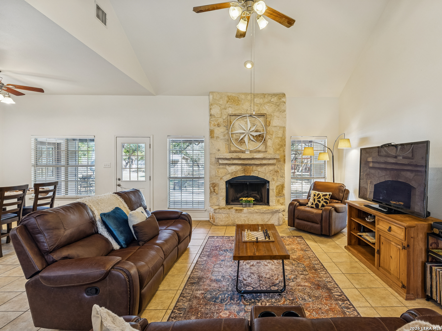 604 Guadalupe Drive Spring Branch, TX 78070 - Photo 11 of 54 a living room with furniture a fireplace and a flat screen tv