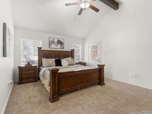 a bed room with a bed and a chandelier