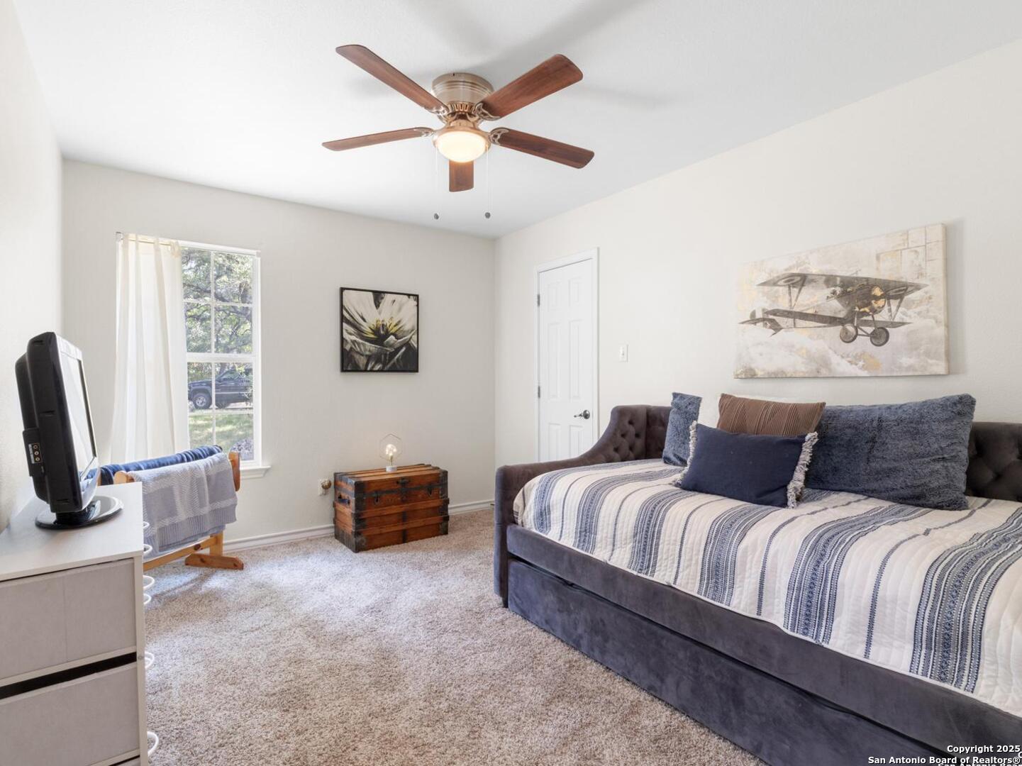 604 Guadalupe Drive Spring Branch, TX 78070 - Photo 20 of 41 a bedroom with a bed and a couch