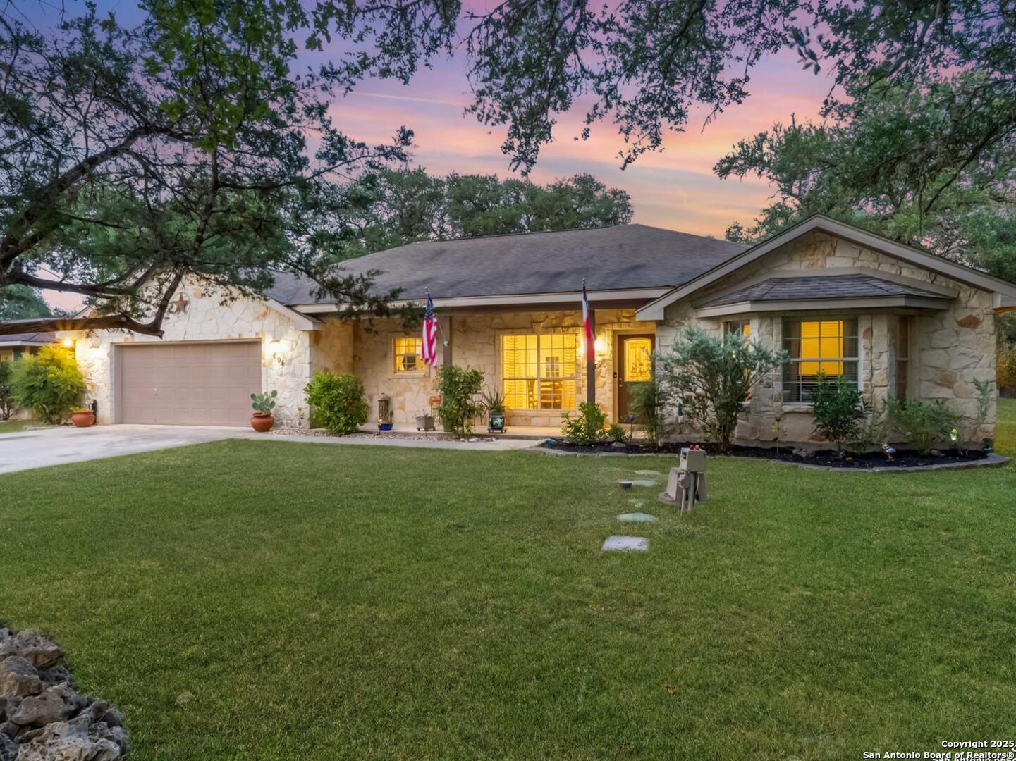 604 Guadalupe Drive Spring Branch, TX 78070 - Photo 2 of 41 a front view of a house with a garden
