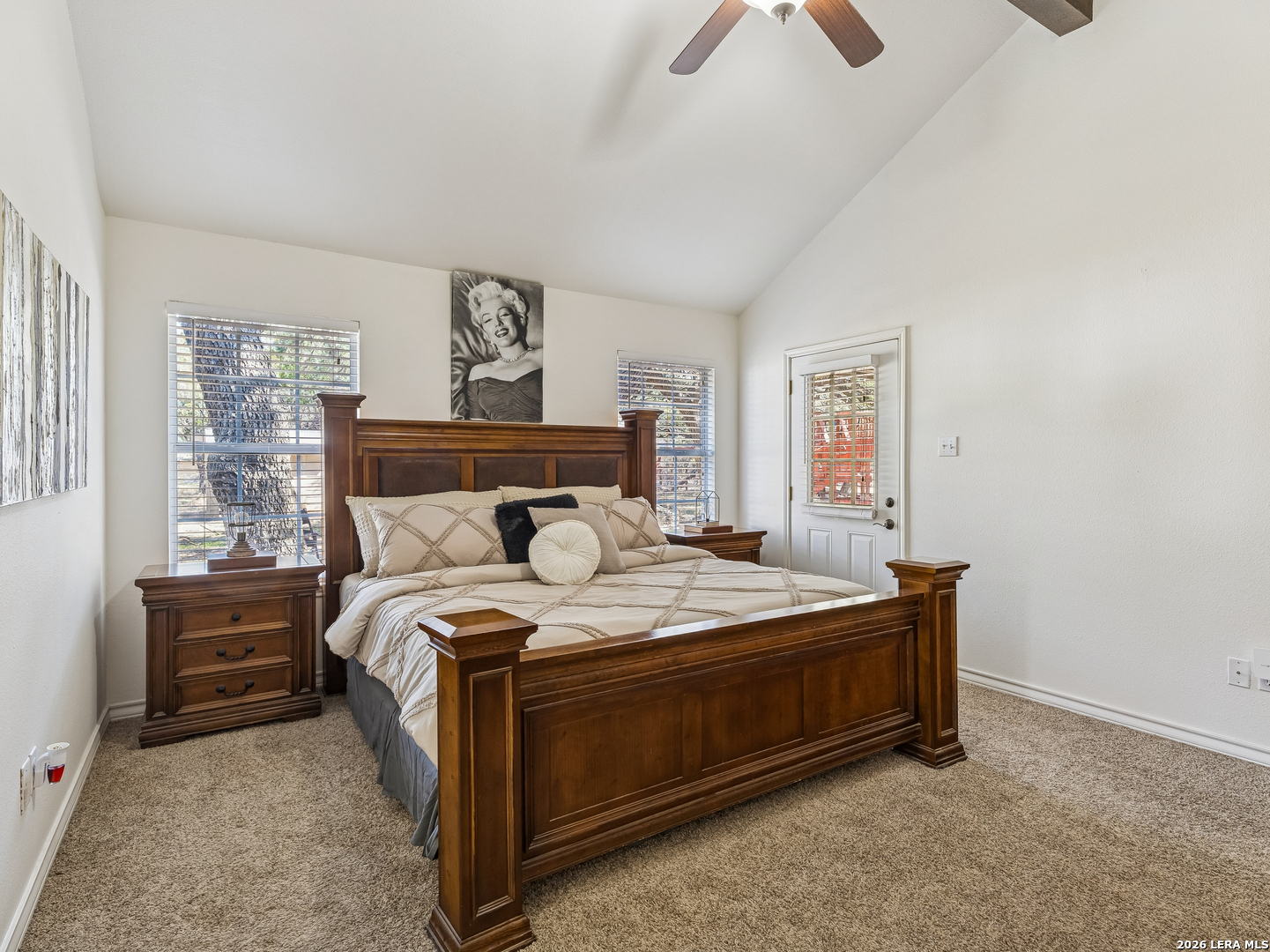 604 Guadalupe Drive Spring Branch, TX 78070 - Photo 24 of 54 a bed sitting in a bedroom next to a window with a chandelier