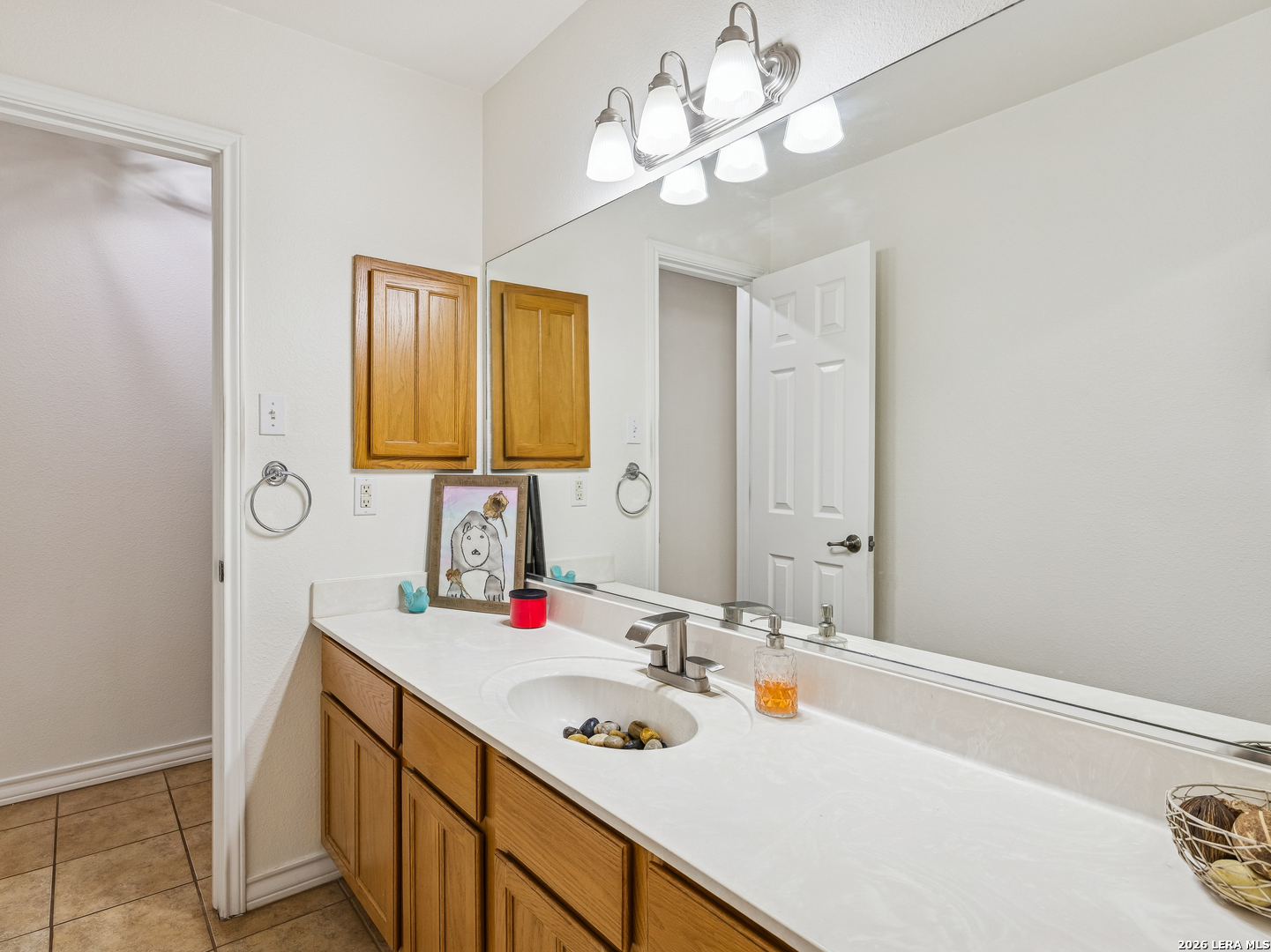 604 Guadalupe Drive Spring Branch, TX 78070 - Photo 32 of 54 a bathroom with a sink and a mirror