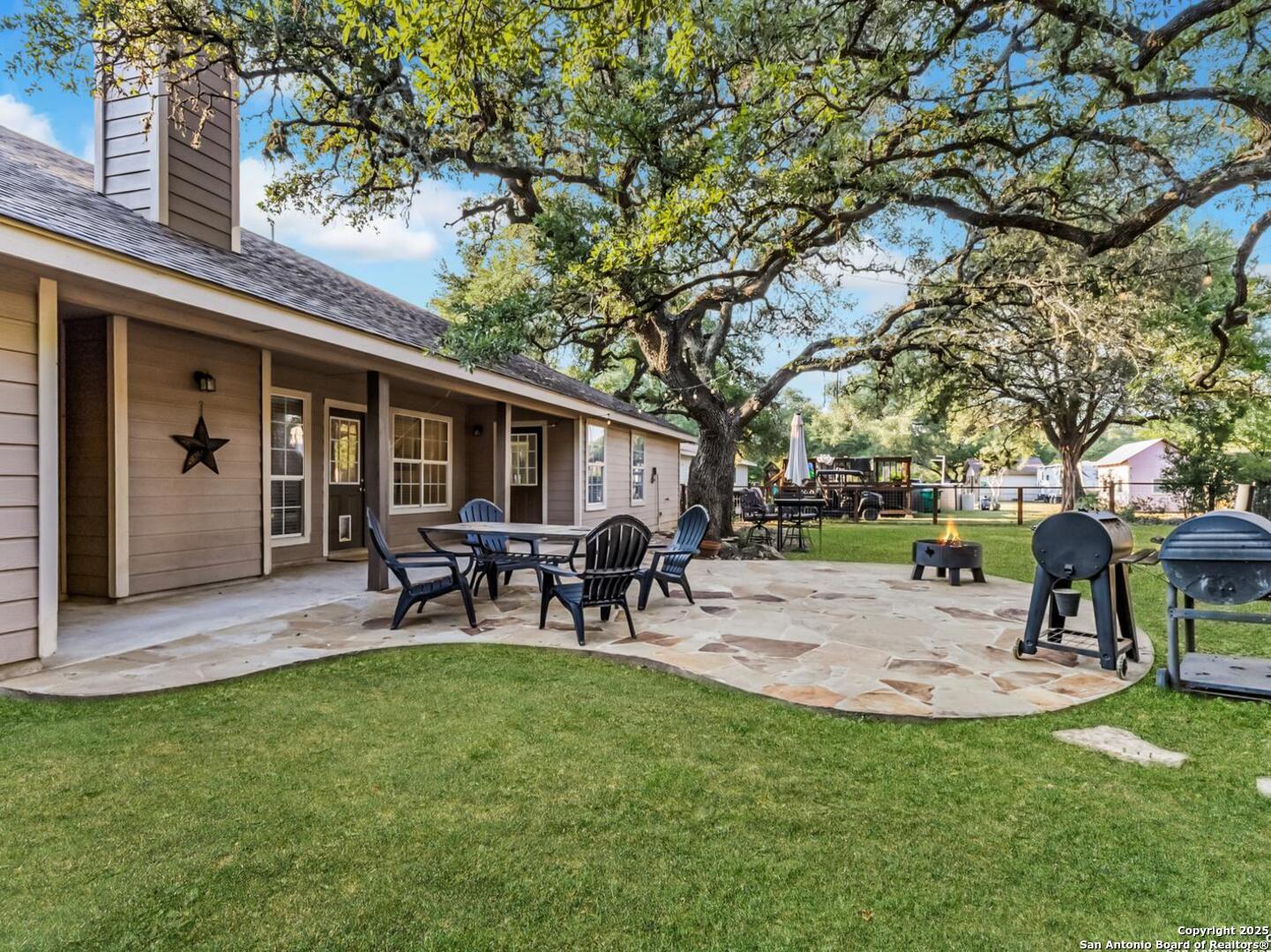 604 Guadalupe Drive Spring Branch, TX 78070 - Photo 36 of 54 a view of a house with a backyard porch and sitting area