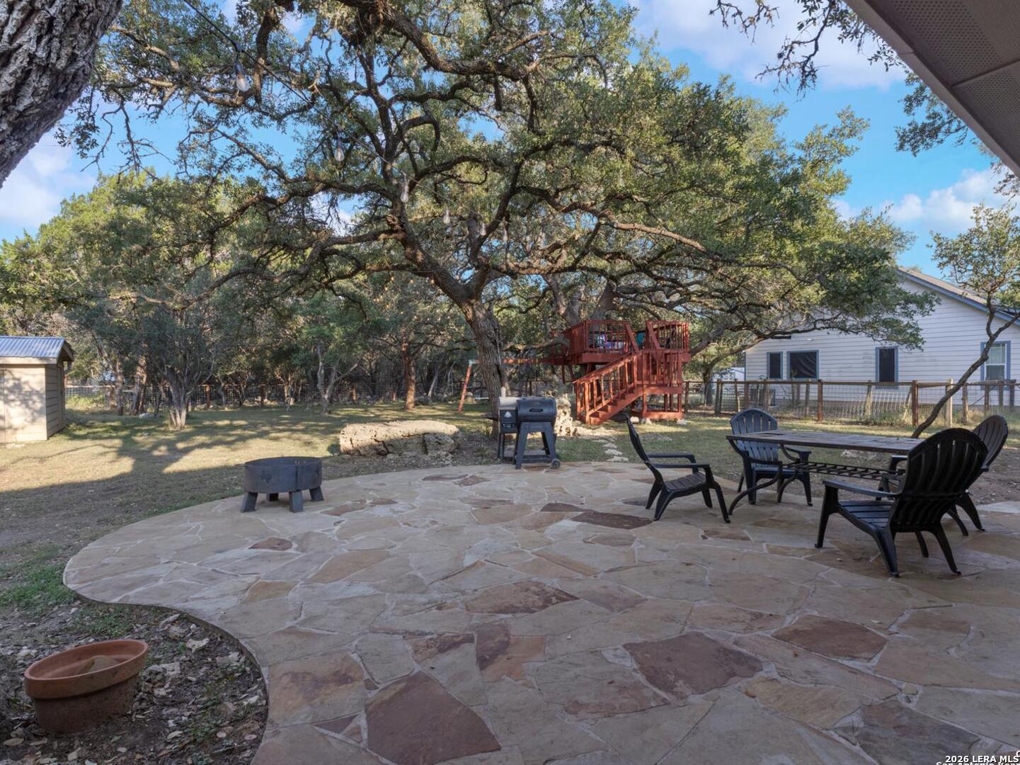 604 Guadalupe Drive Spring Branch, TX 78070 - Photo 38 of 54 a backyard of a house with table and chairs